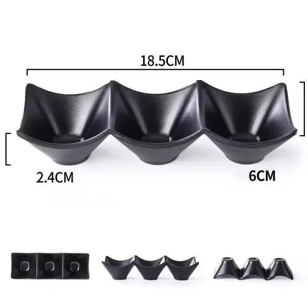 Black ceramic three-lobed dish with measurements on a white background