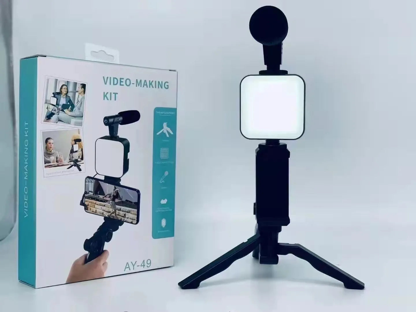 Video-making kit with light and microphone on a white background