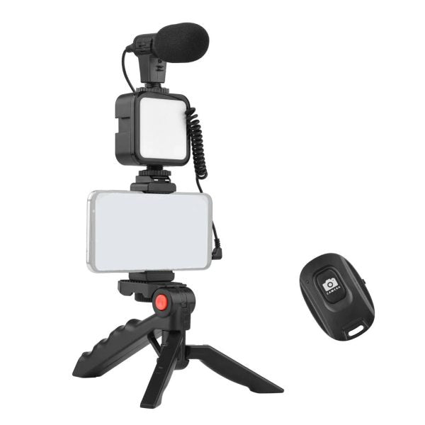 Video recording setup with microphone, light, and remote control on a white background