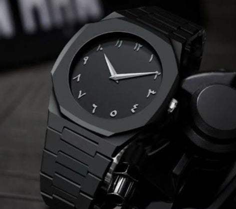Black wristwatch with a dark background
