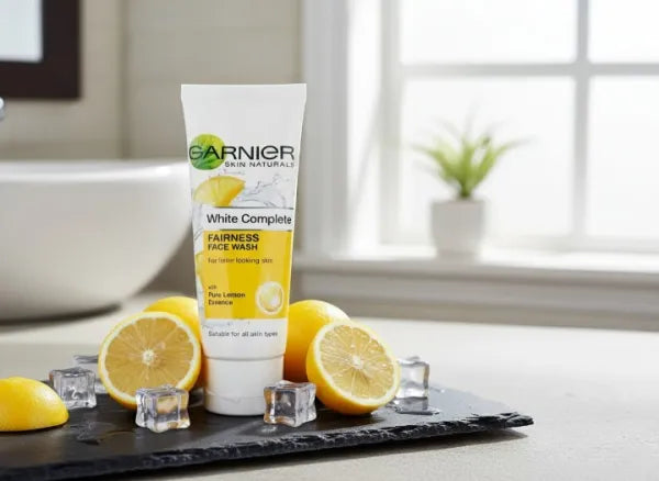 Garnier White Complete fairness face wash with lemons on a table