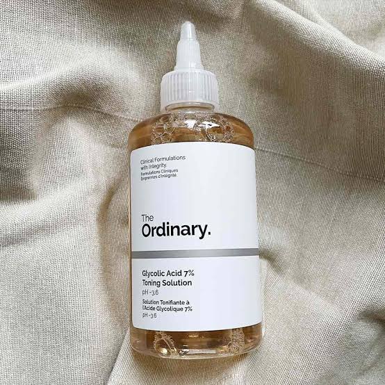 Bottle of 'The Ordinary' Glycolic Acid 7% Toning Solution on a textured beige background